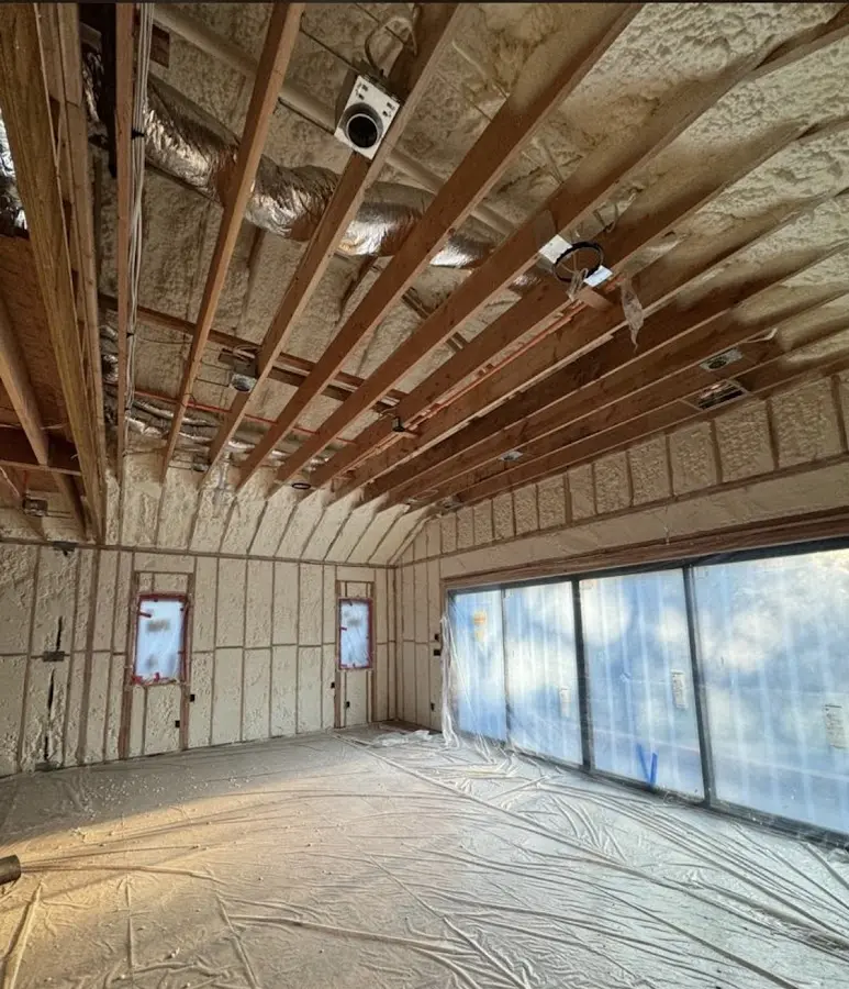 Interior walls and ceiling insulated with spray foam during new construction in St. Helens